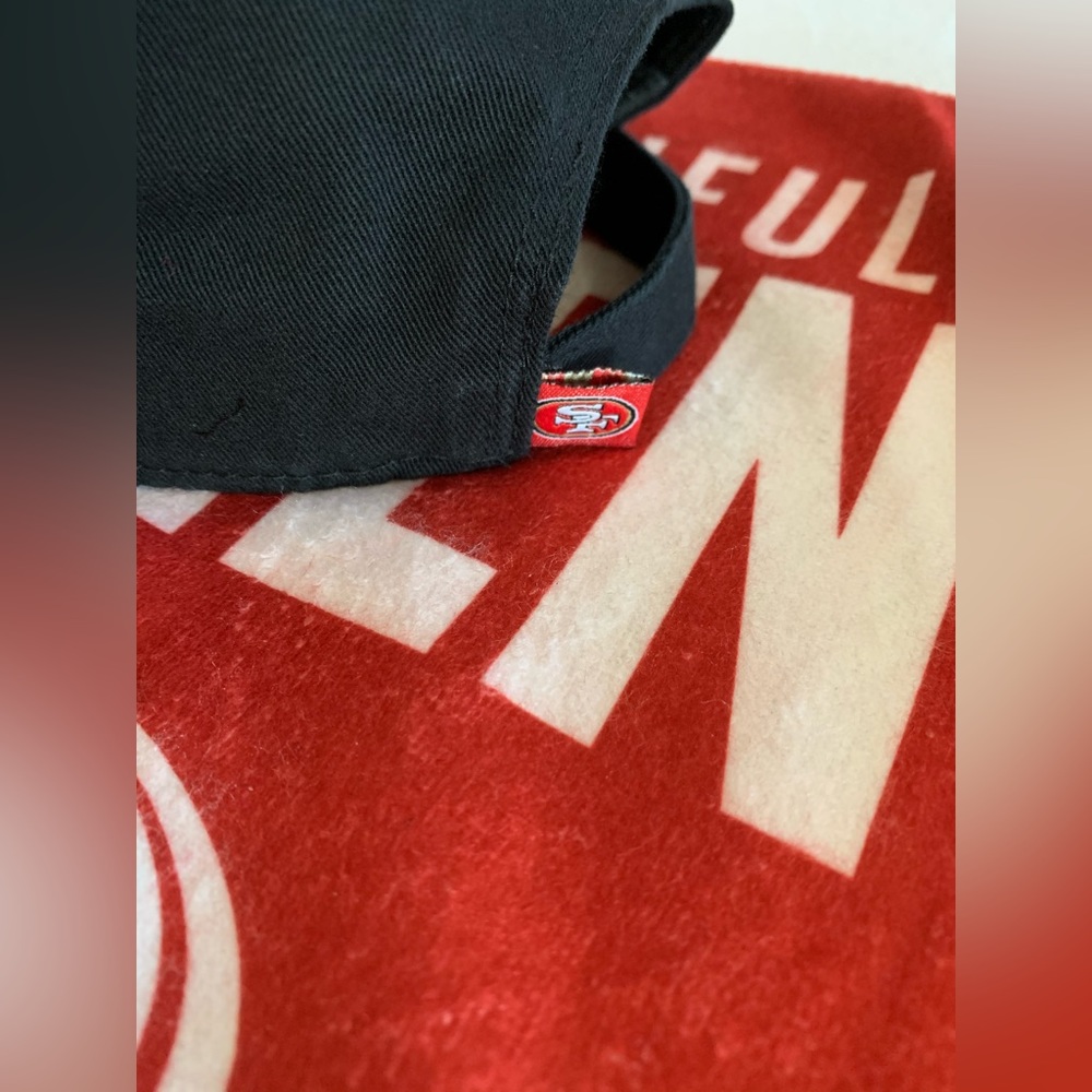 NEW! 49ers black adjustable hat and rally towel. From smoke free pet free home.
